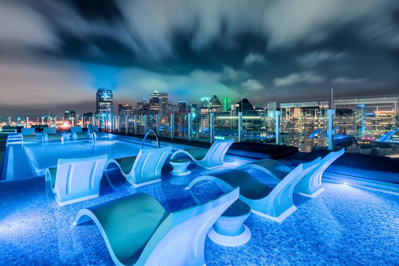 Humphreys Partners Architects One Uptown Rooftop Pool Evening